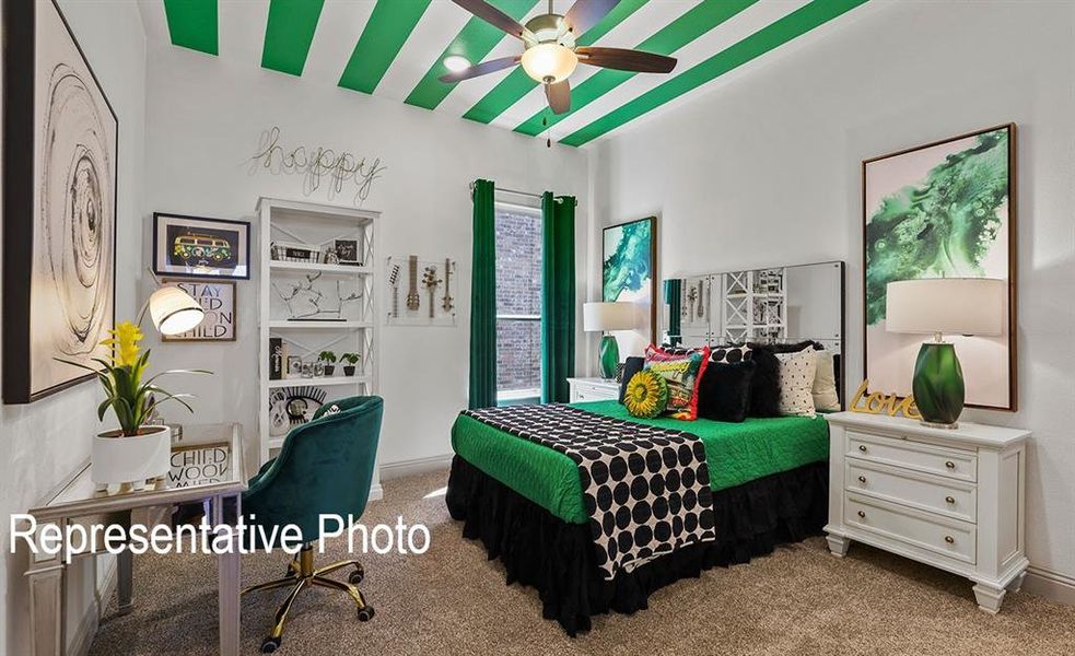 Carpeted bedroom with ceiling fan