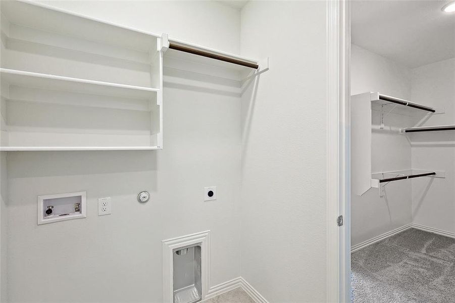 Laundry area featuring hookup for a washing machine, carpet flooring, electric dryer hookup, and hookup for a gas dryer