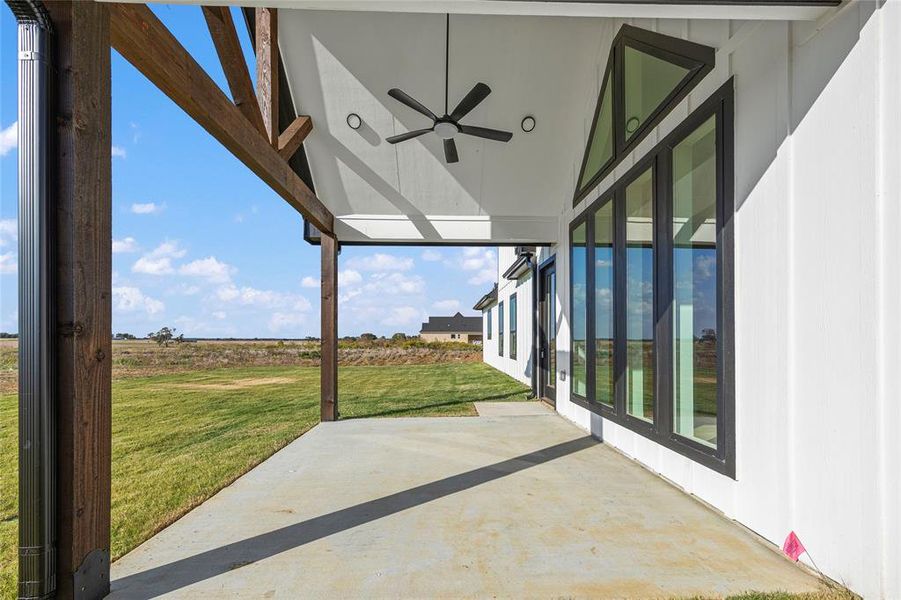 View of patio featuring ceiling fan