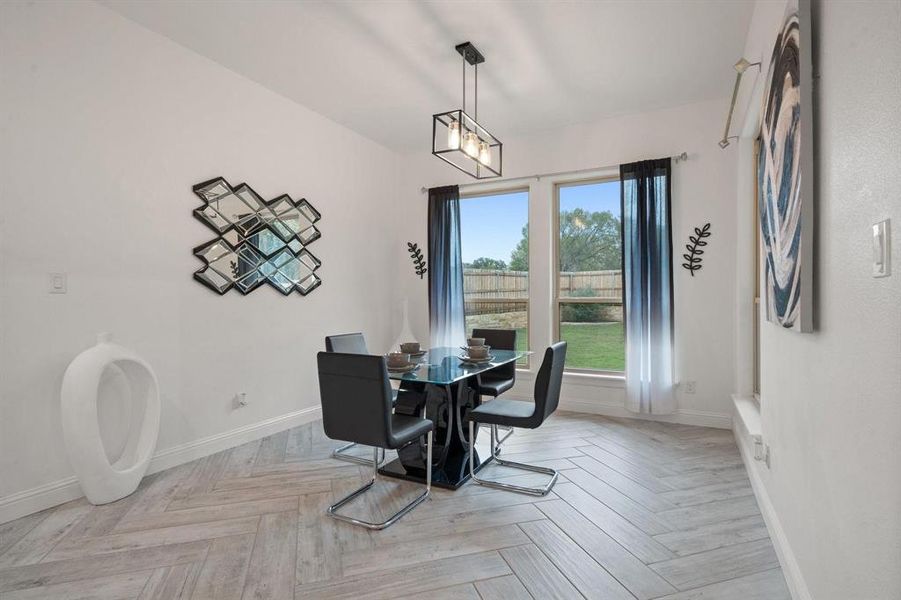 Dining space featuring light parquet flooring