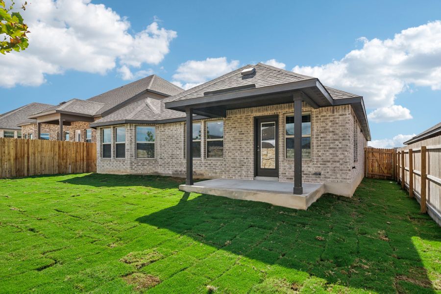 Back exterior of the the FItzhugh floorplan in a Meritage Homes community.