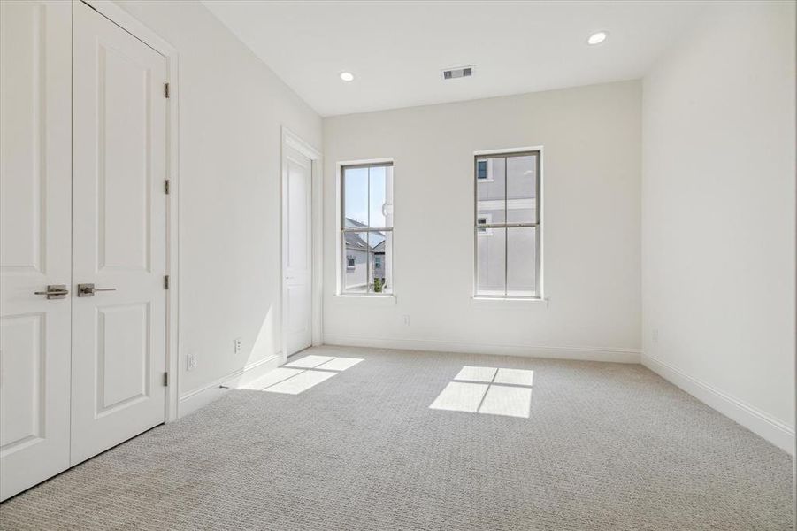 2nd 3rd story bedroom. Large space with lots of natural light.