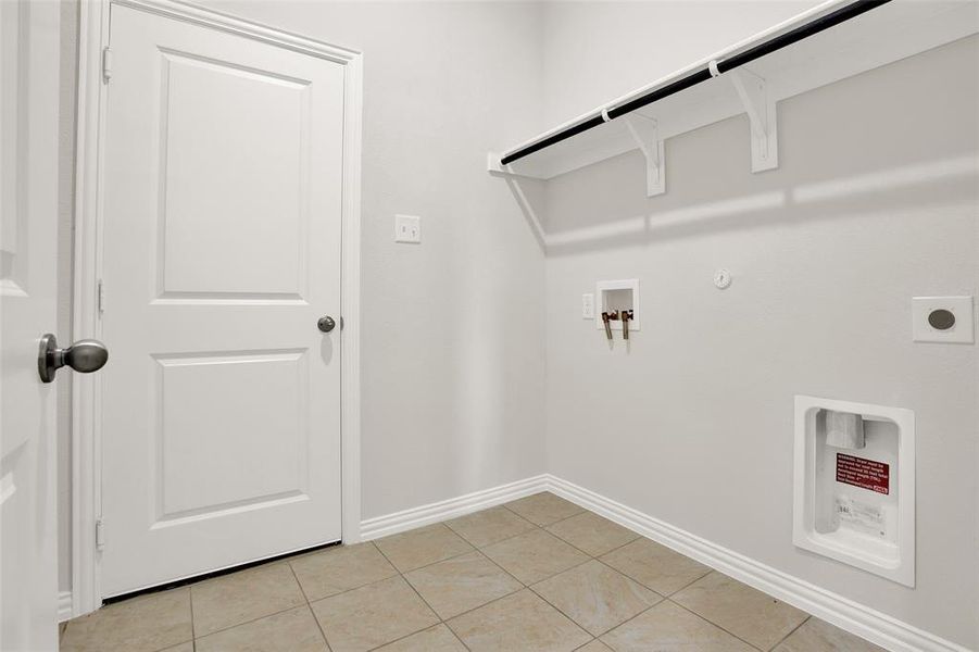 Laundry room featuring washer hookup, hookup for an electric dryer, hookup for a gas dryer, and light tile floors