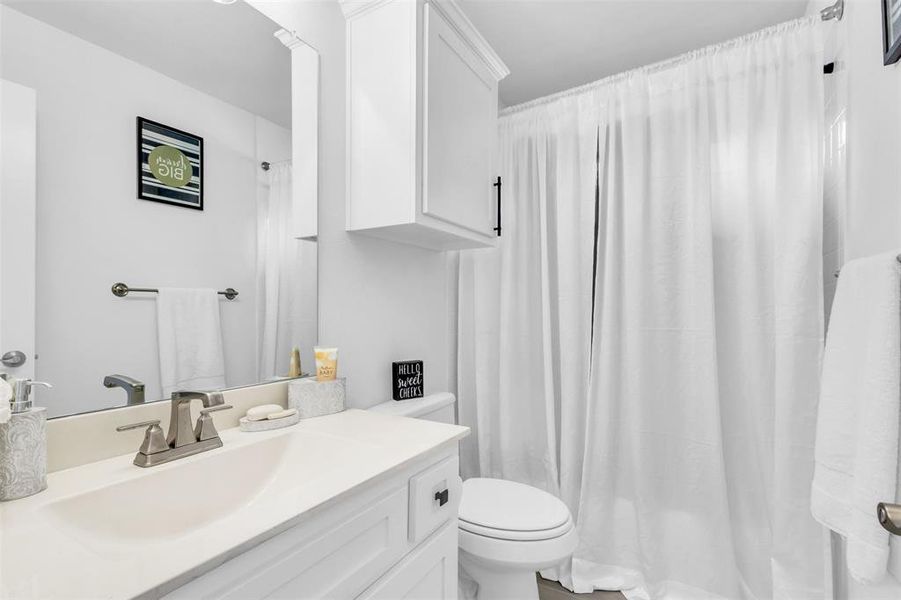 Bathroom with vanity and toilet