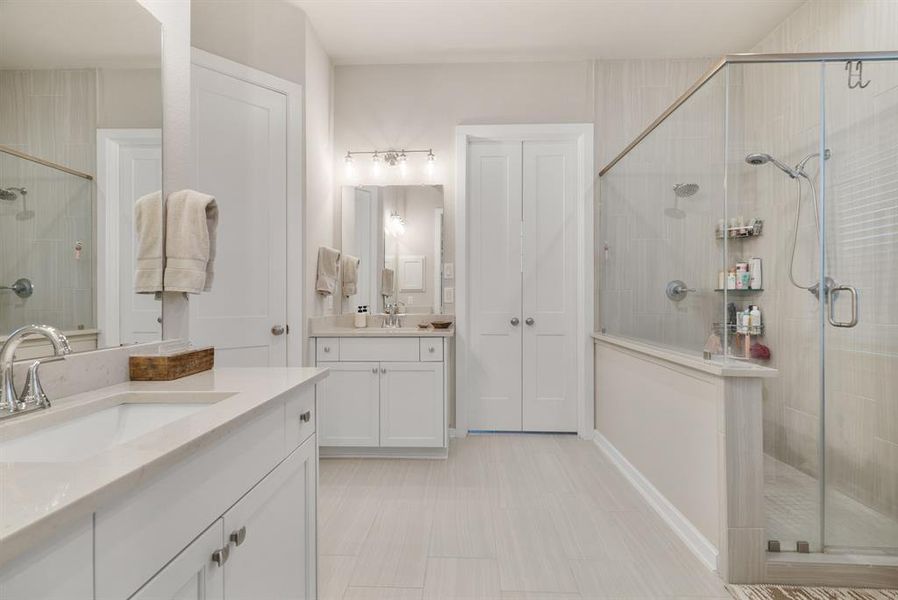 Floor to ceiling tile in shower. Nice and bright!