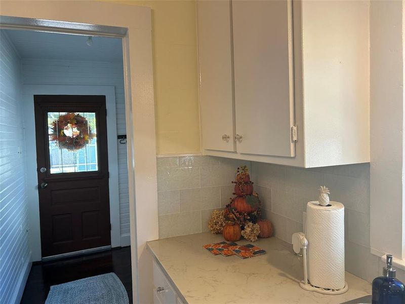 Kitchen, leading through Laundry Room to Back Door.