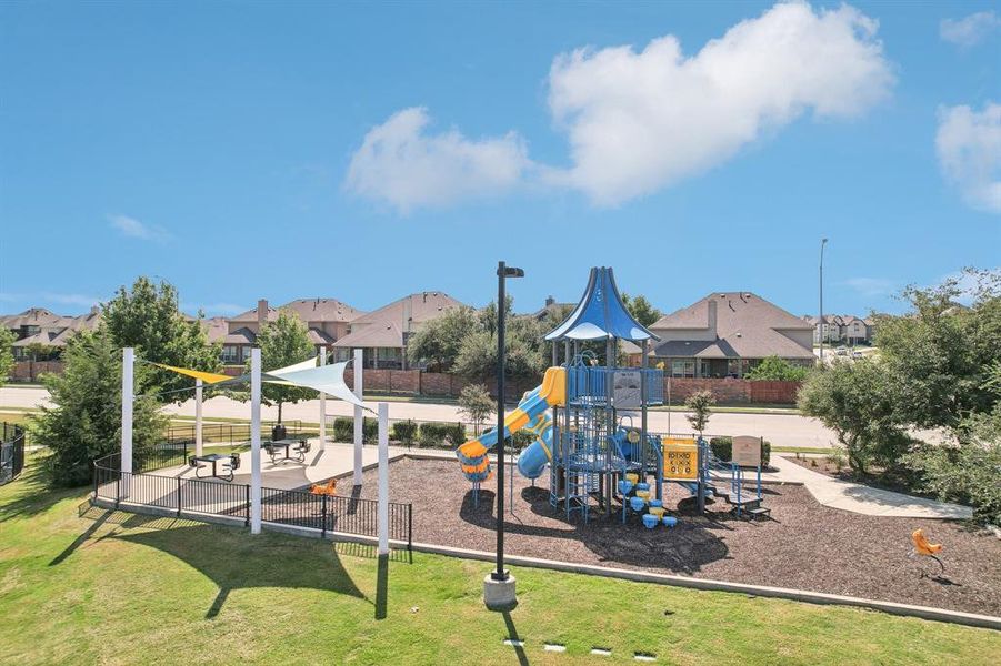 View of play area with a lawn