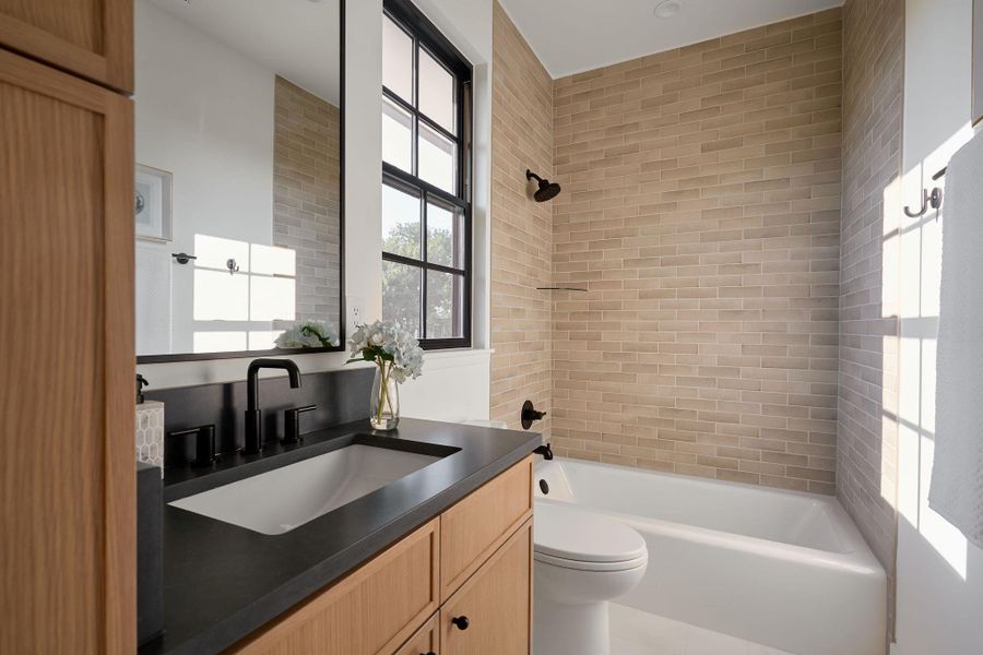 Four full bathrooms throughout the house. This is one of the secondary bathrooms upstairs.