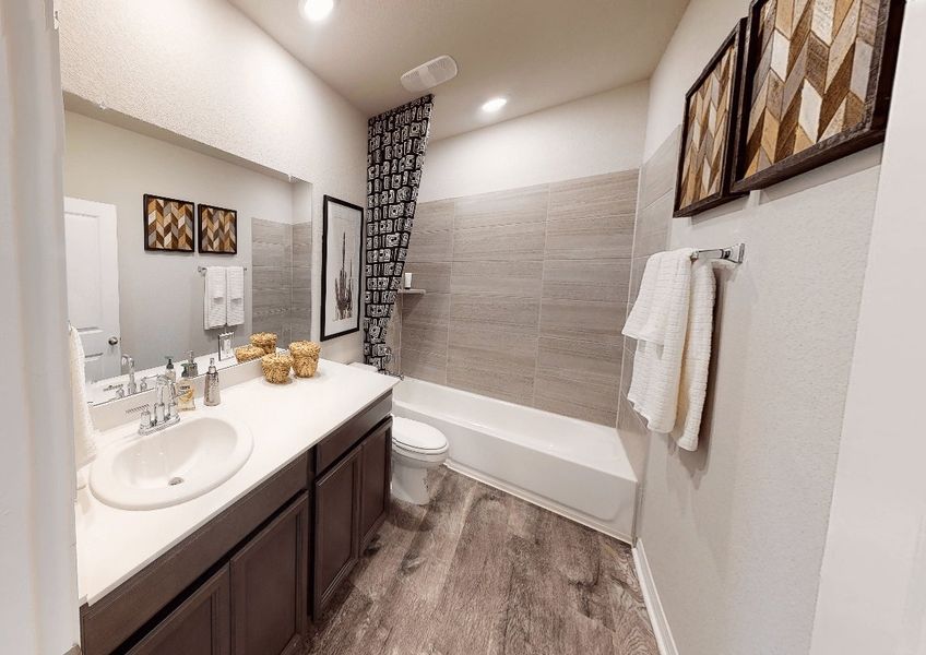 Family or guests can enjoy this luxurious secondary bathroom.