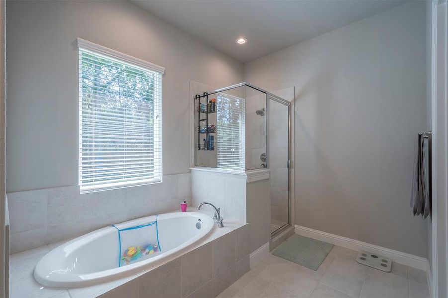 The primary ensuite measures 13x9 with a garden soaking tub, separate shower and water closet.