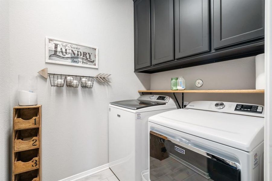 Laundry cabinets and shelves were added, along with a barn door!