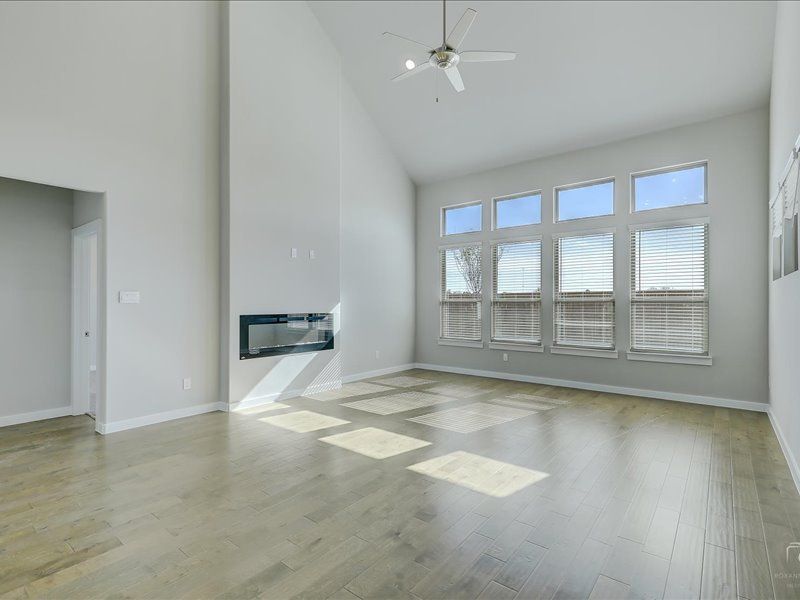 Living room in the Mercury home plan by Trophy Signature Homes – REPRESENTATIVE PHOTO