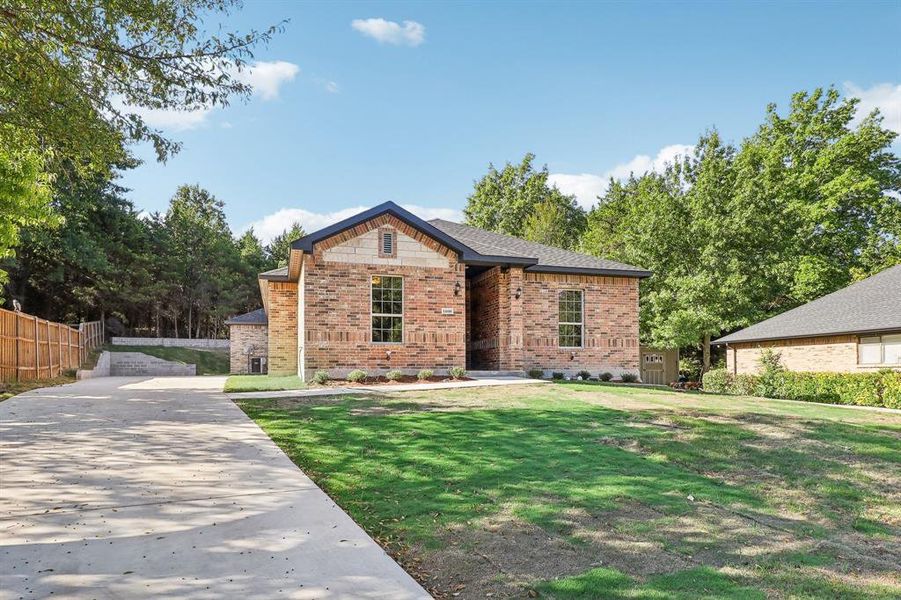 View of front of property with a front yard