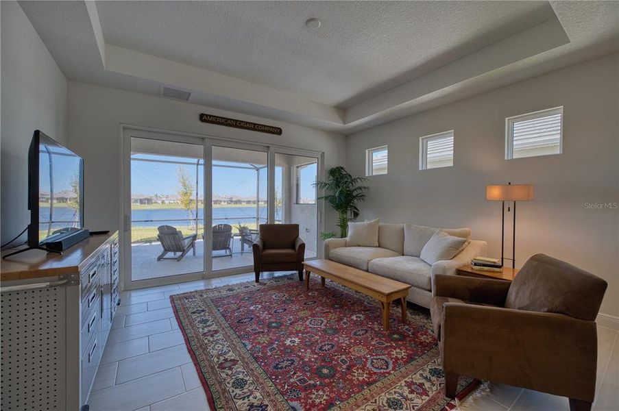 The gathering room has a lake view through the lanai.