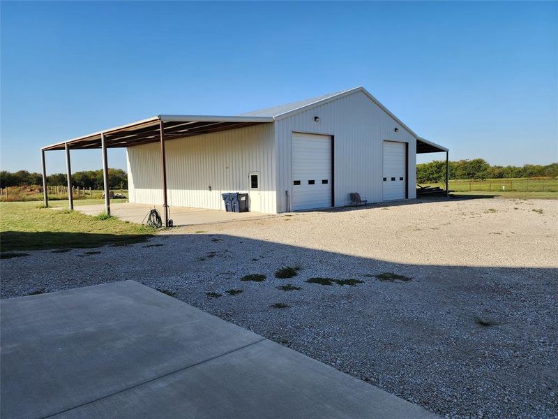 View of outbuilding featuring a garage