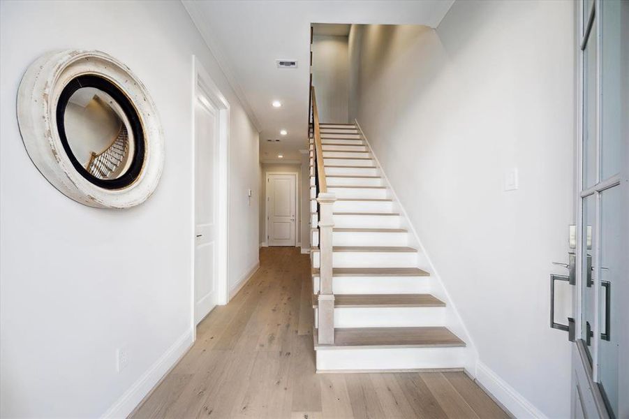 Entry level staircase connecting all 3 floors