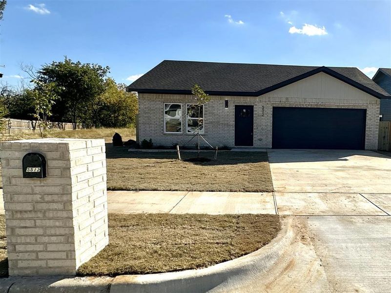 View of front of property with a garage