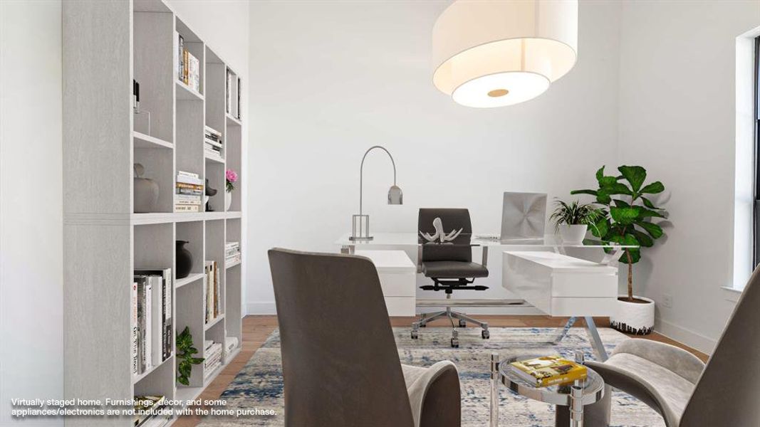 Home office with hardwood / wood-style flooring