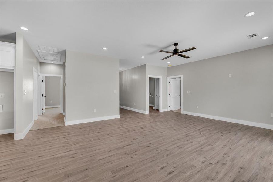 Spare room with light wood-type flooring and ceiling fan