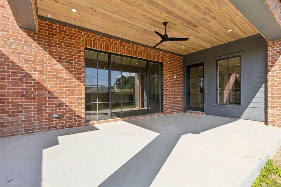 View of patio featuring ceiling fan