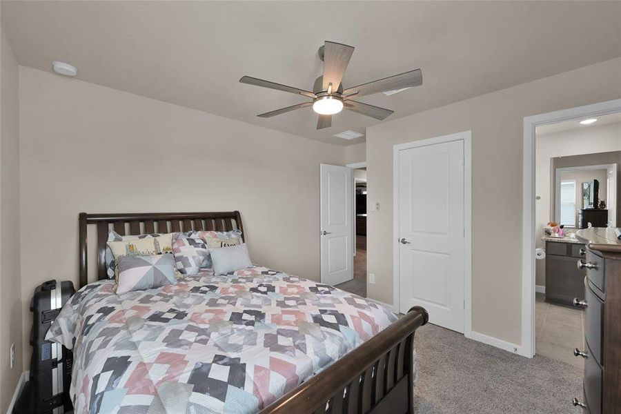 Another vantage point of this generously sized upstairs bedroom with an en suite bathroom for your guests to enjoy.