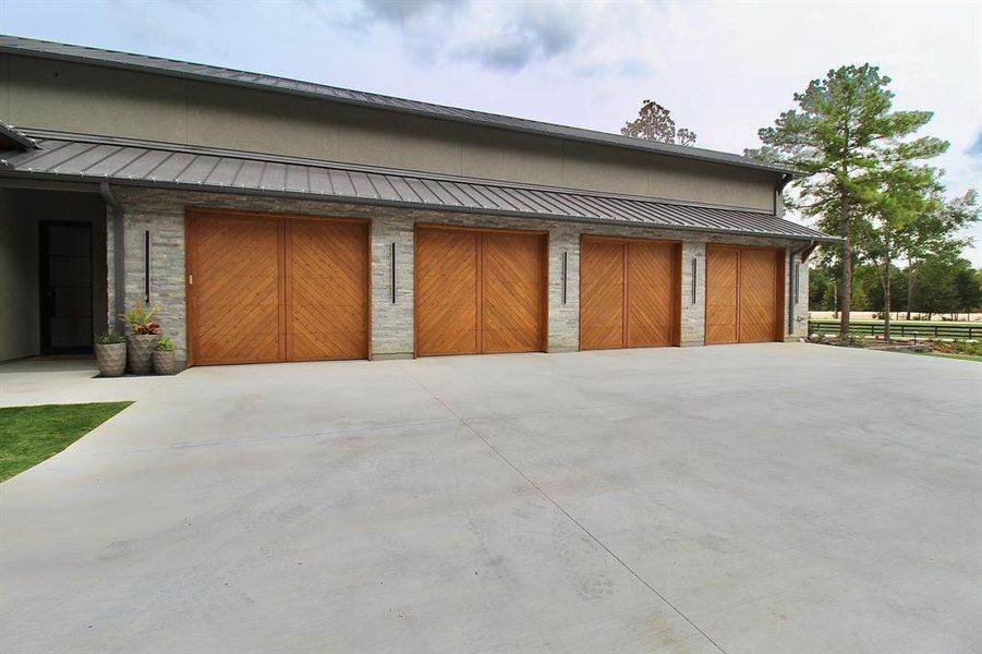 Spectacular 4-car garage with tons of driveway and storage space!