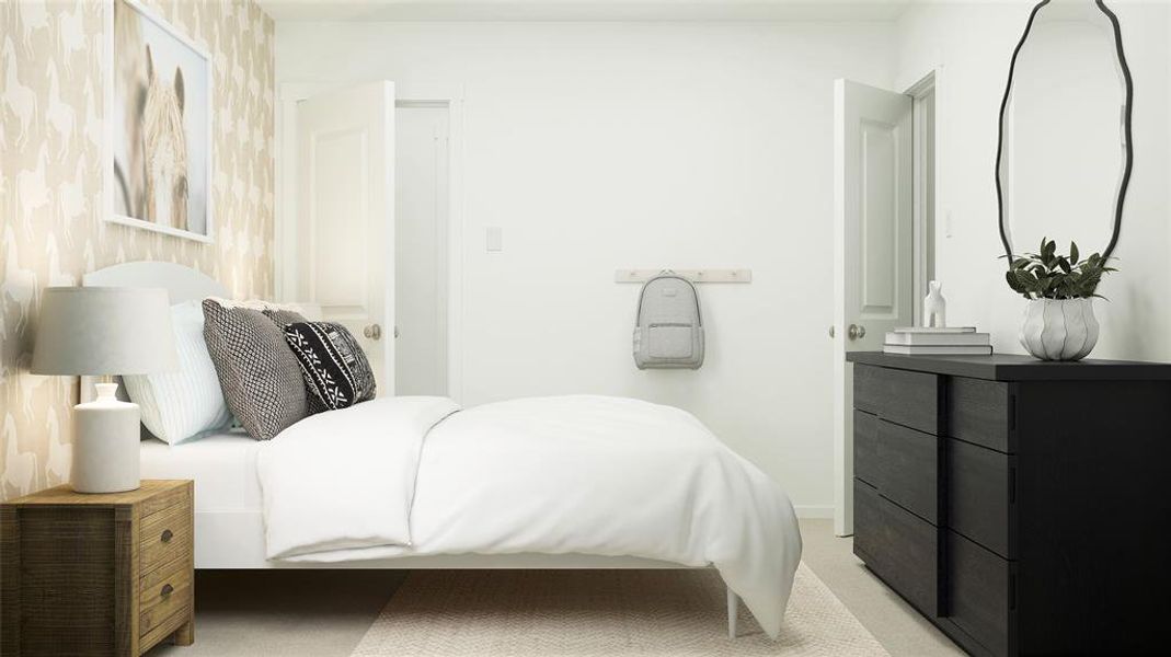 Bedroom featuring light colored carpet