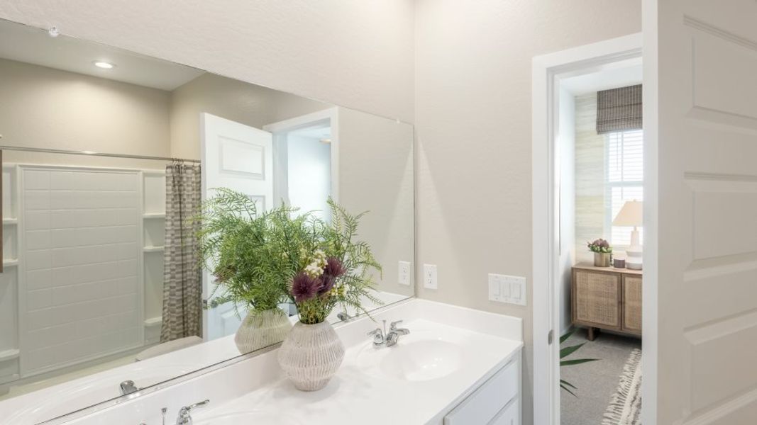 Jerome en suite bathroom with bedroom visible through the doorway