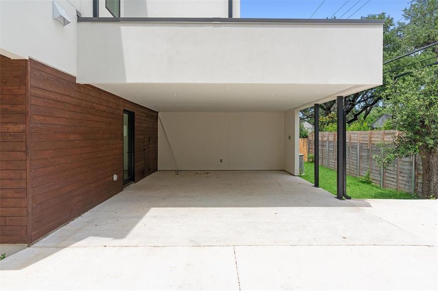 Covered carport with ample space for 2 cars has direct access to the mud room area off the kitchen.