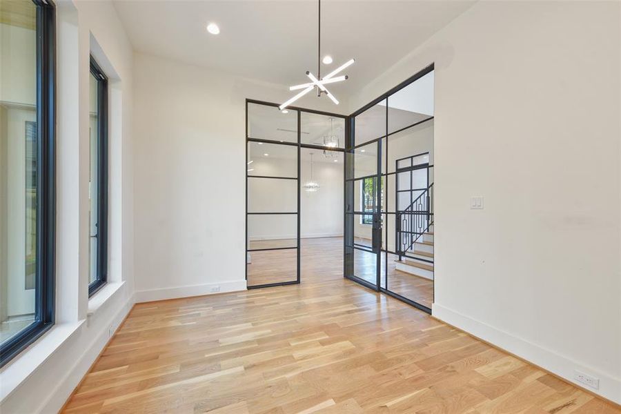 The clean sleek lines and contemporary fixtures offer a transitional feel to the warm wood and large windows of this custom home.