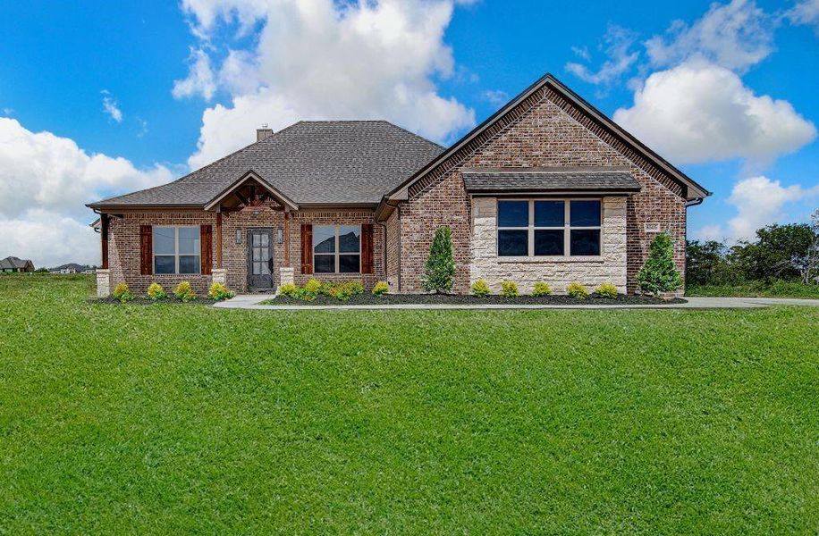 Craftsman-style home featuring a front lawn