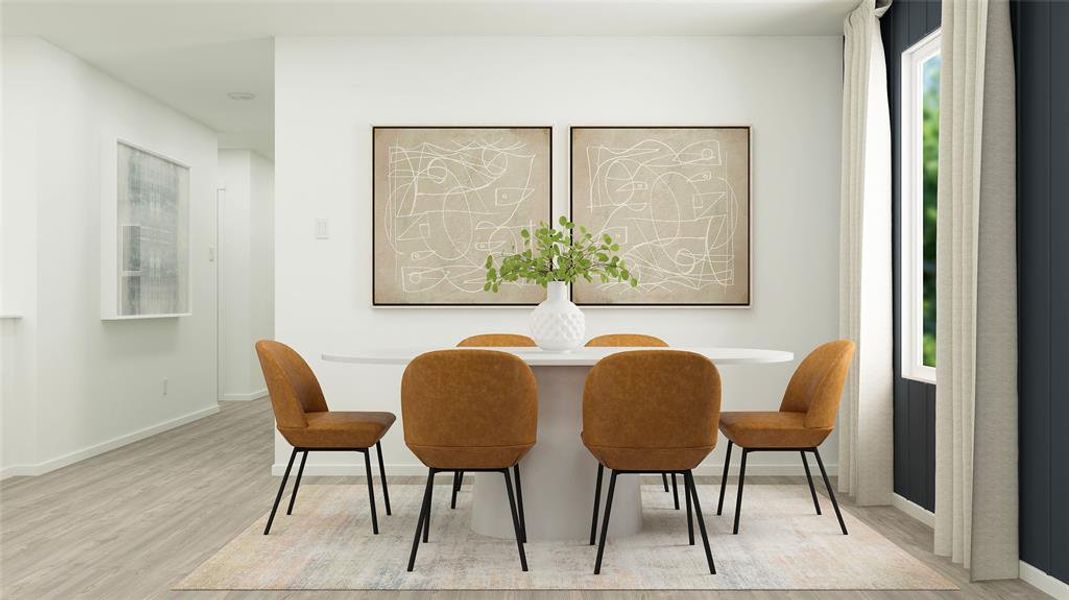 Dining area with light hardwood / wood-style flooring