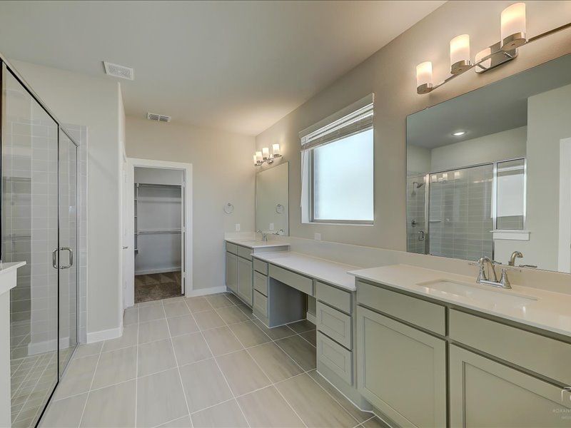 Primary bathroom in the Mercury home plan by Trophy Signature Homes – REPRESENTATIVE PHOTO