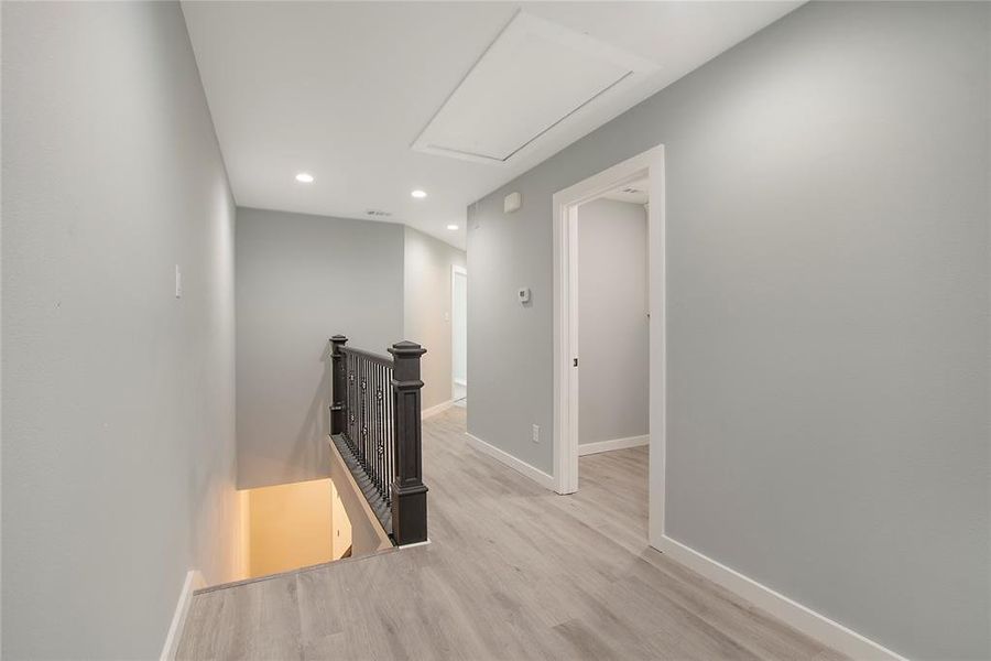 Hallway with light wood-type flooring