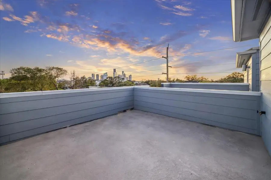 This expansive fourth-floor rooftop deck provides breathtaking views of the downtown skyline, making it the perfect spot for relaxation or entertaining guests. With ample space for outdoor furniture and dining, this private retreat offers a serene escape from the urban hustle while keeping the cityscape within reach.