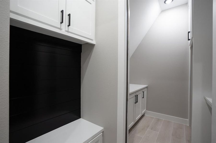 Upon entry from the garage you will see this mud room area with the laundry room to your right.