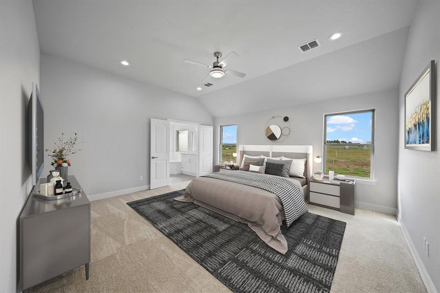 Bedroom featuring connected bathroom, ceiling fan, multiple windows, and lofted ceiling