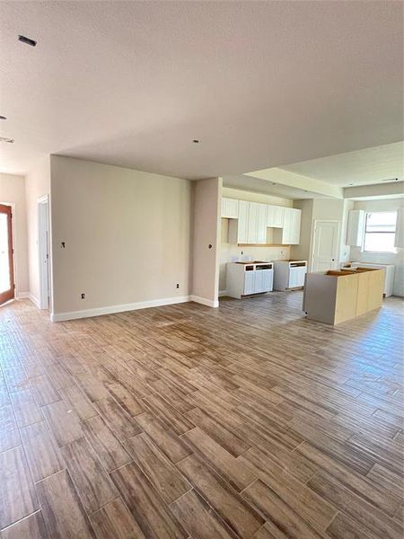 Unfurnished living room with hardwood / wood-style floors