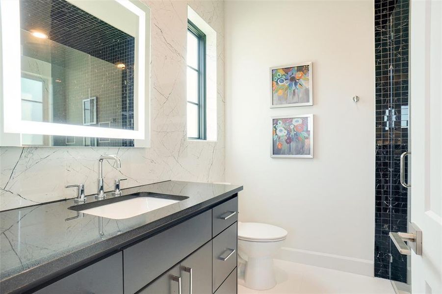 Bath with LED Edge Lit Mirror & Quartzite Counters with Incredible Floor to Ceiling Custom Bookmatch Tile with Floating Vanity Vessel Sink & Linen Closet...