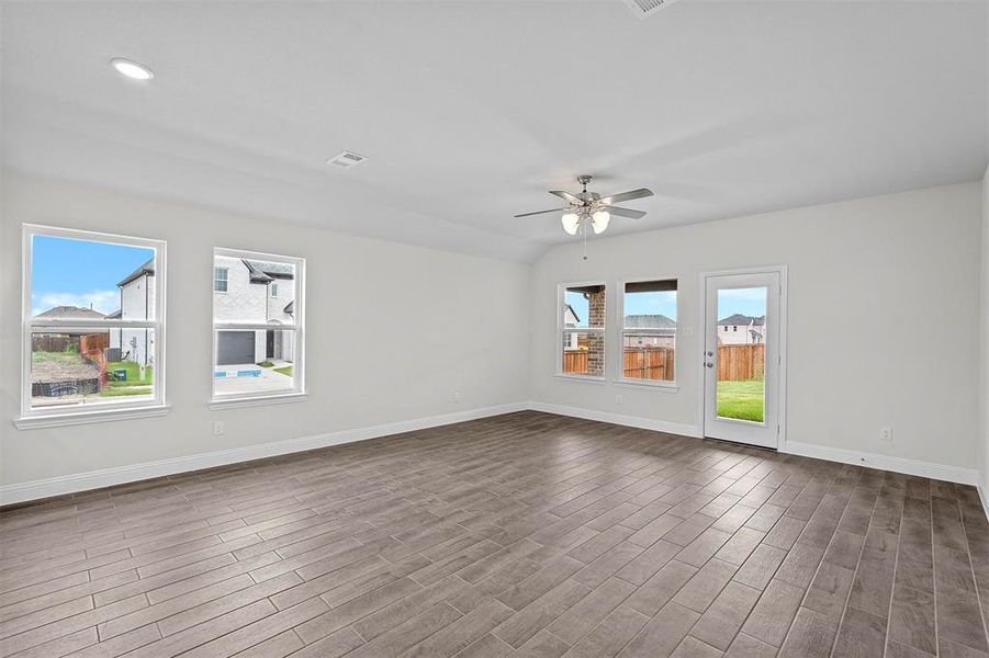 Spare room with ceiling fan and hardwood / wood-style flooring