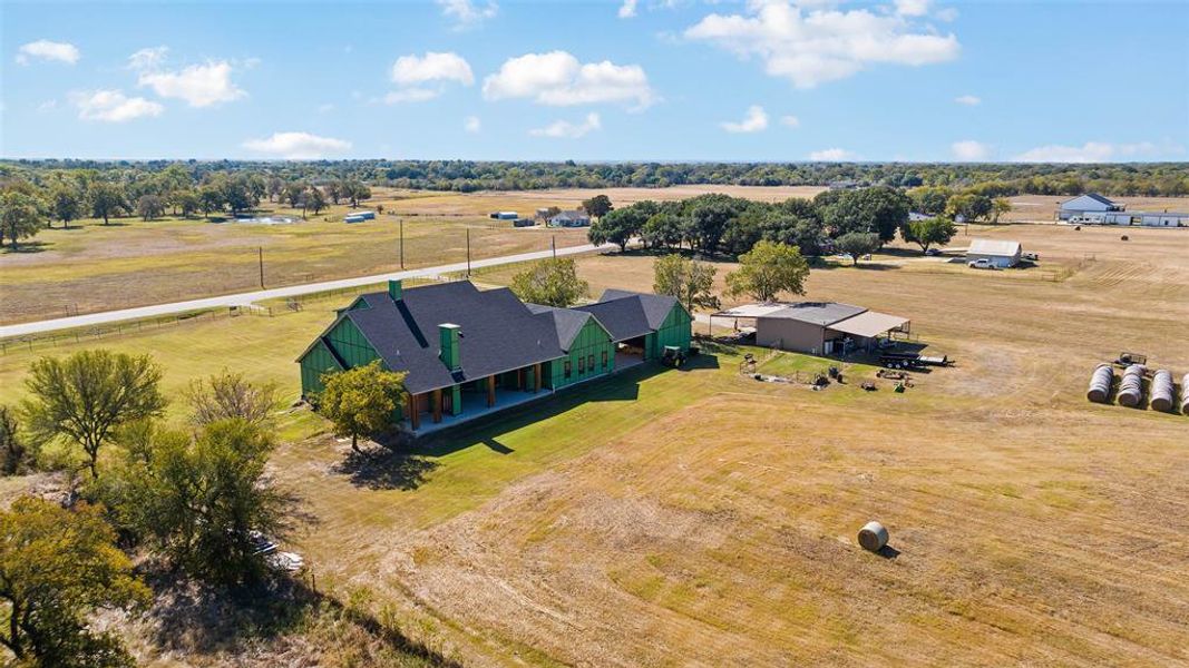 Birds eye view of property featuring a rural view