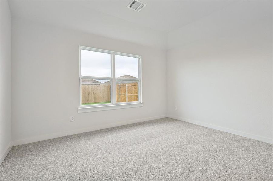 Empty room with carpet flooring