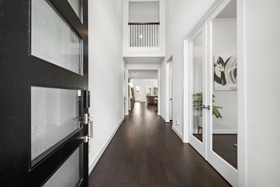 Entry way and living room feature 18 ft. vaulted ceilings.