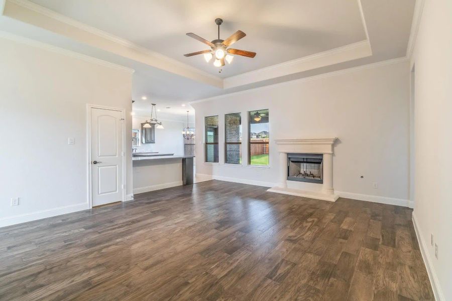 Family Room to Kitchen | Concept 2027 at Villages of Walnut Grove in Midlothian, TX by Landsea Homes