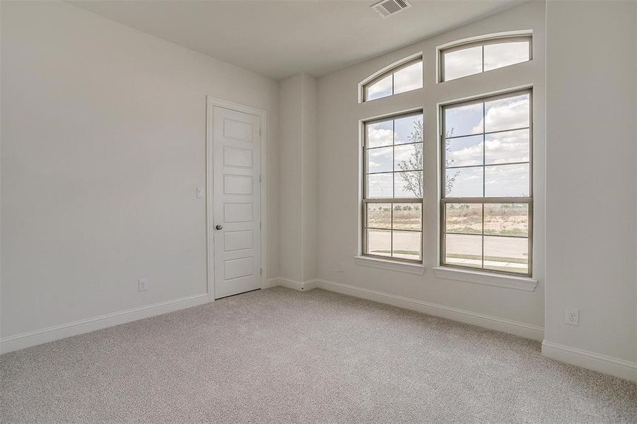 View of carpeted spare room