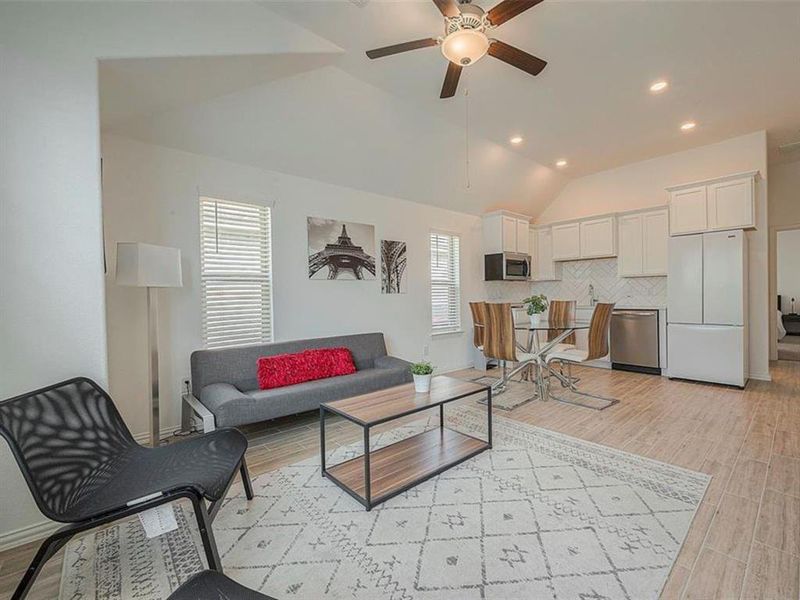 This living room features comfortable seating and a coffee table, perfect for relaxing and entertaining guests.