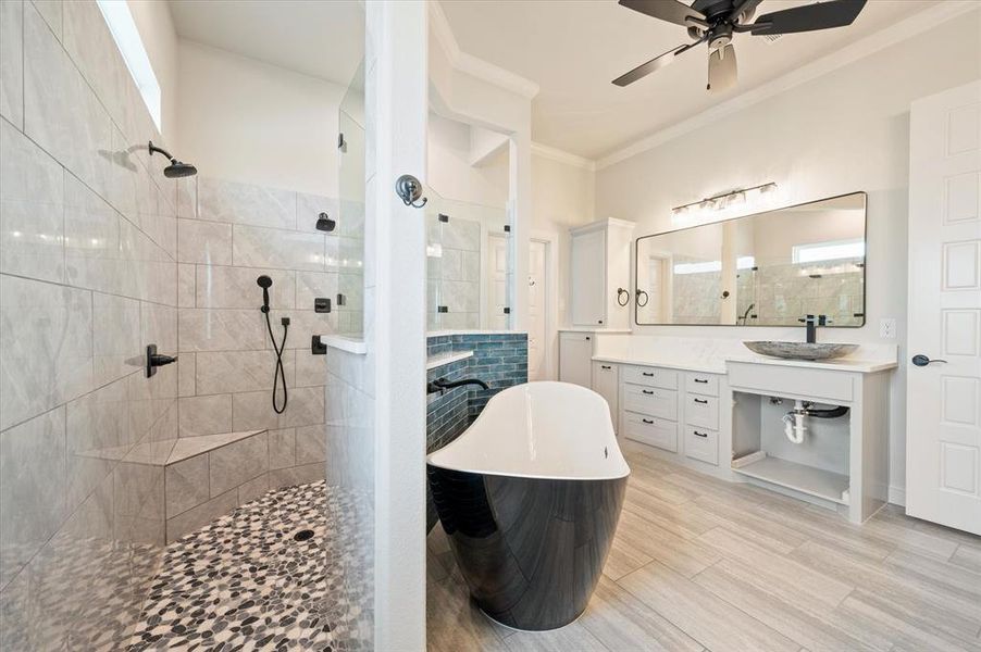 Bathroom with plus walk in shower, tile patterned floors, vanity, ceiling fan, and ornamental molding