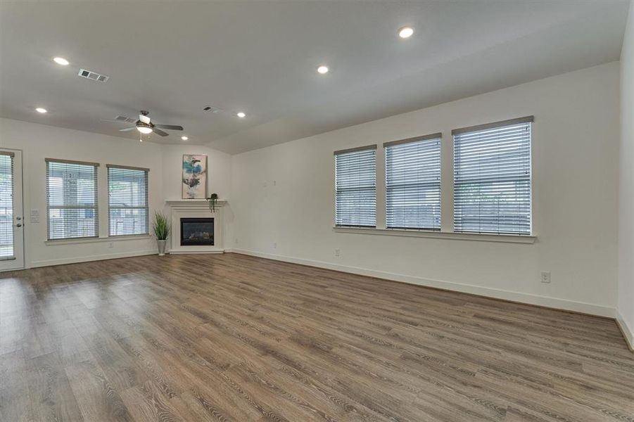 A wall of windows on two sides to illuminate this gorgeous living area.