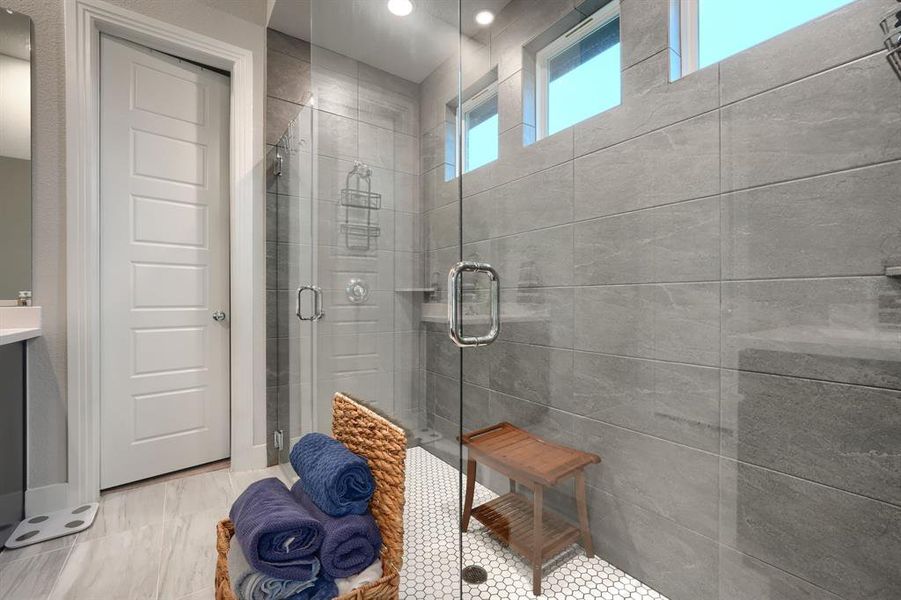 Bathroom featuring a healthy amount of sunlight and an enclosed shower