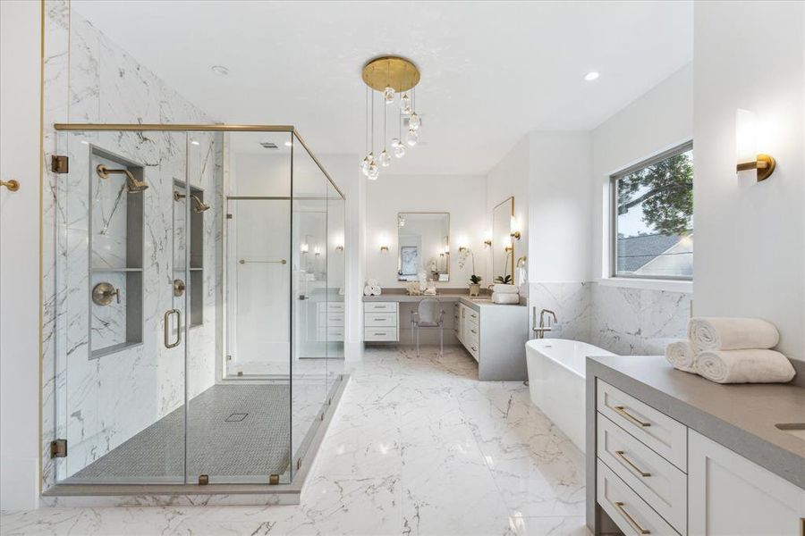 Every element of the primary bathroom has been meticulously designed to evoke a sense of timeless beauty and sophistication. From the sleek lines of the vanities to the exquisite details of the shower and tub, this space is a testament to the art of modern luxury living.